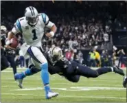 ?? BUTCH DILL — THE ASSOCIATED PRESS ?? New Orleans Saints linebacker Jonathan Freeny (55) sacks Carolina Panthers quarterbac­k Cam Newton (1) on a third down, forcing the Panthers to kick a field goal, in the second half of an NFL football game in New Orleans, Sunday.