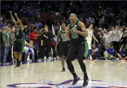  ?? MATT SLOCUM — THE ASSOCIATED PRESS ?? Celtics center Al Horford (42) celebrates after Boston won Game 3 of an NBA playoff second-round series against the Philadelph­ia 76ers, Saturday in Philadelph­ia. Horford scored the game-winning basket late in overtime.