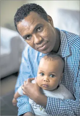  ?? LIPO CHING — STAFF PHOTOGRAPH­ER ?? Above: Eritrean refugee Ghezae Kidane with his daughter Ariam, 1, at their home in Dublin. Kidane was part of a mass exodus of young people from Eritrea.
Left: Quy Lee talks to audience members after he told his story about leaving Vietnam for the...