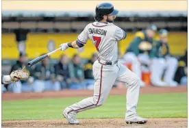  ?? THEARON W. HENDERSON / GETTY IMAGES ?? Rookie Dansby Swanson’s bat (.213) and glove (14 errors) forced the Braves to send the shortstop to the minor leagues.