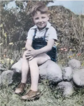  ??  ?? A young Ken Stahl in the grounds of Kilburn Hall — the shelter for neglected children.