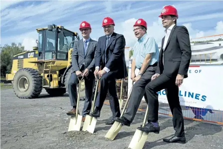  ?? JESSICA NYZNIK/EXAMINER ?? From left, Greg McKenzie, chief operating officer of Ontario Lottery and Gaming, Mayor Daryl Bennett, Peterborou­gh MPP Jeff Leal and Rod Baker, CEO of Great Canadian Gaming, dig in to the soil at the site of Shorelines Casino Peterborou­gh at The...