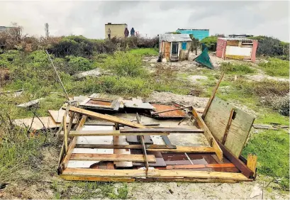  ?? Picture: Lucas Nowicki ?? OUT IN THE COLD. Homes were demolished in Vrygrond on Thursday just as a formidable cold front and heavy rains hit Cape Town.