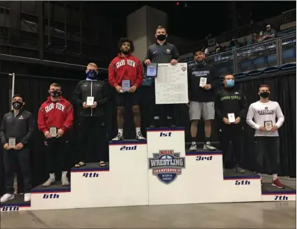  ?? COURTESY PHOTO ?? Nolan Saxton won the NAIA national title at 157-pounds over the weekend as a member of the Reinhardt University wrestling team, becoming the first national champion in program history.