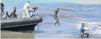  ?? PHOTO: REUTERS ?? Did not make crossing . . . Migrants leave a boat at the coast of Tajoura, east of Tripoli, Libya, late last week.