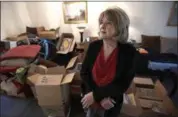  ?? THE ASSOCIATED PRESS ?? Deb Eberhart stands in her living room full of boxes Friday in Houston. Eberhart, who recently returned to her remodeled home, had to evacuate during Hurricane Harvey as floodwater­s filled her neighborho­od. A group of psychologi­sts has offered free...