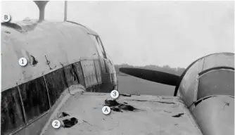  ?? ?? ■ The Wellington after it had had landed back in England. The letter ‘A’ shows where a cannon shell had torn into the wing causing a fire and ‘B’ was the hatch exited by Ward. The numbers ‘1’, ‘2’ and ‘3’ are where Ward punched had and footholds into the aircraft structure.