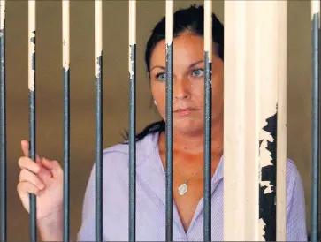  ?? Picture: AAP Image/Mick Tsikas ?? Time to come home: Schapelle Corby at the holding cells at the Denpasar District Court after her sentencing submission­s by her defence team in Bali in 2005.