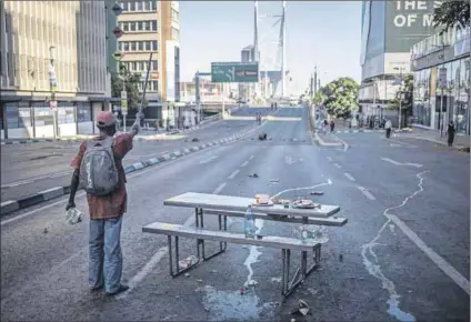  ?? Photo: Michele Spatari/afp ?? Right to be heard: Urban political or service delivery protests such as one in Johannesbu­rg on 11 March by the Economic Freedom Fighters often intentiona­lly disrupt traffic. A group of 16 women from Colenso was arrested, charged and found guilty after inadverten­tly stopping a truck during their protest.