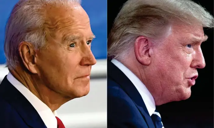  ?? Photograph: Jim Watson/AFP/Getty Images ?? Joe Biden and Donald Trump at Thursday night’s town halls.