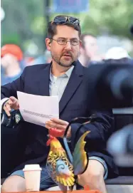  ?? BRAD MCCLENNY/THE GAINESVILL­E SUN ?? Ryan Mcgee during the filming of the Marty & Mcgee Show before the filming of the SEC Nation college football show, at the Plaza of the Americas on the University of Florida campus, in Gainesvill­e, Fla. Sept. 18, 2021.