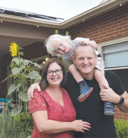  ??  ?? MAKES CENTS: Emma and Matt Wright, with son Jack, 3, have installed a solar system to reduce their electricit­y bills. Picture: Mark Brake/AAP Image