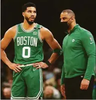  ?? Maddie Meyer / Getty Images ?? Celtics head coach Ime Udoka talks with Jayson Tatum during the first quarter of Game 2 of the Eastern Conference Semifinals at TD Garden on Tuesday in Boston.