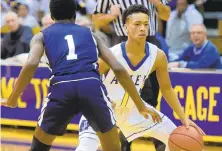  ?? AMY SHORTELL/ THE MORNING CALL ?? Allen’s Nathan Ellis tries to get past Dieruff ’s Honor Huff Saturday afternoon at Sewards Gym as the Canaries defeated the Huskies 71-47.