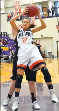  ?? Photos by Annette Beard ?? Gravette’s Tori Foster grabs a rebound during Saturday’s consolatio­n game against Pea Ridge in the conference tournament played at Berryville.