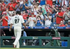  ?? DERIK HAMILTON — THE ASSOCIATED PRESS ?? Fans applaud as Philadelph­ia Phillies starting pitcher Aaron Nola walks off the field after he was relieved during the seventh inning of a baseball game against the Toronto Blue Jays, Saturday.