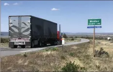  ?? SONNER
AP PHOTO/SCOTT ?? A northbound truck crosses the Modoc County line in Northern California along the high Sierra’s eastern front, about 160 miles north of Reno, Nev., Friday, near Likely, Calif. strictions.