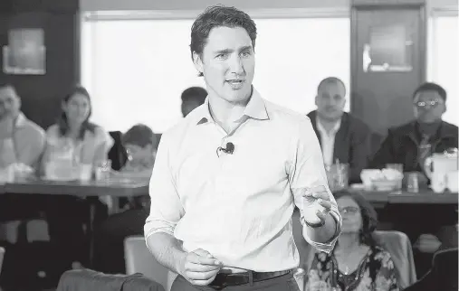  ?? ADRIAN WYLD / THE CANADIAN PRESS ?? The most unsavoury aspect of the Justin Trudeau plan is the tax grab under the cloak of class envy, writes Post columnist John Ivison.