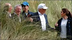  ??  ?? LINKS: Gilbert, second left, with Trump at his Aberdeen golf course