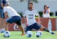  ?? AP ?? Lionel Messi stretches during training session ahead of match against Chile in Buenos Aires. —