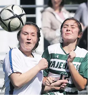  ?? DAN JANISSE ?? Katie Zuccato of Cardinal Carter, left, and Erika Boismier of Lajeunesse battle for the ball during a game last month. The Lajeunesse Royals are now playing at the OFSAA girls’ A championsh­ip in Toronto.