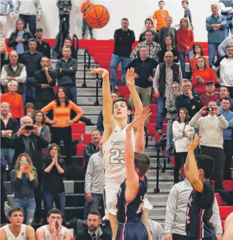  ?? | ALLEN CUNNINGHAM/ FOR THE SUN- TIMES ?? Libertyvil­le senior Drew Peterson ( 30 points) sinks the winning three- pointer as time expires in overtime.