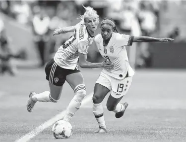  ?? Martin Rose / Getty Images ?? Crystal Dunn, right, was effective against Sweden and in thwarting forward Sofia Jakobsson, left.