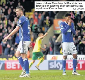  ?? JOE GIDDENS ?? Ipswich’s Luke Chambers (left) and Jordan Spence look dejected after conceding a late equaliser at Carrow Road