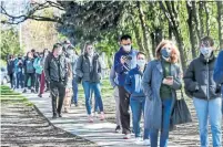  ?? ANDREW FRANCIS WALLACE TORONTO STAR ?? Long queues have become common outside pop-up vaccinatio­n clinics. Health experts say there’s no ideal, one-size-fits-all approach, but better communicat­ion around capacity is needed.