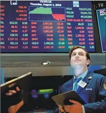  ?? Drew Angerer Getty Images ?? MOMENTS after President Trump tweeted about tariffs, the Dow Jones industrial average erased all of its 300-point gain.