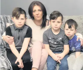  ??  ?? Robbed at home Mum Kerry-Ann with Leo, 10, Kelvin, 7, and six-year-old Finlay