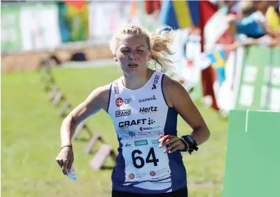  ?? FOTO: SUUNNISTUS­LIITTO/TOUHO HäKKINEN ?? Marika Teini tog sin första individuel­la VM-medalj då hon var tvåa på medeldista­nsen i Lettland.
■