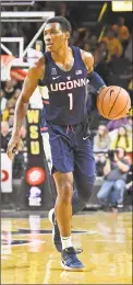  ?? Peter G. Aiken / Getty Images ?? After briefly testing the NBA waters, UConn’s Christian Vital has decided to return to the Huskies.