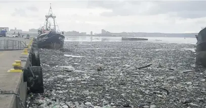  ?? Picture: Reuters ?? AFTERMATH. Debris floats in Durban’s harbour after a storm at Wilson’s Wharf. This image was obtained from social media.