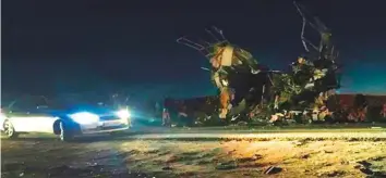  ?? AFP ?? The wreckage of the bus that was reportedly blown up in a suicide attack in southeaste­rn Iran yesterday. A militant group called Jaish Al Adl claimed responsibi­lity.