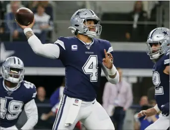  ?? MICHAEL AINSWORTH — THE ASSOCIATED PRESS ?? Cowboys quarterbac­k Dak Prescott throws a pass against the Rams on Sunday.
