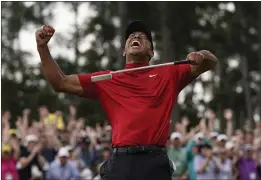  ?? DAVID J. PHILLIP — THE ASSOCIATED PRESS, FILE ?? Tiger Woods reacts as he wins the Masters on April 14in Augusta, Ga.