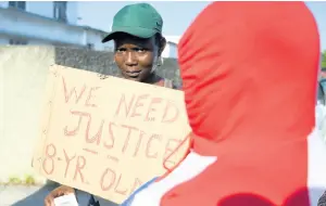  ?? RICARDO MAKYN/CHIEF PHOTO EDITOR ?? A protester from Richie Lane demonstrat­es yesterday against the killing of eight-year-old Galen Buchanan, whose body was found in the Kingston Harbour on Thursday.