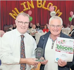  ?? ?? Flower power Councillor Michael Mcpake (left), and 2023’s overall In Bloom award winner Tommy Ellis, from Airdrie