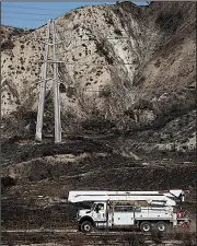  ?? AP/CHRISTIAN MONTERROSA ?? A SoCal Edison truck arrives Tuesday to inspect a transforme­r tower in Sylmar, Calif., suspected of being responsibl­e for sparking a fire in the Southern California area last week. Meanwhile, a California utilities official blasted Pacific Gas & Electric its recent planned power outage intended to reduce fire risk.