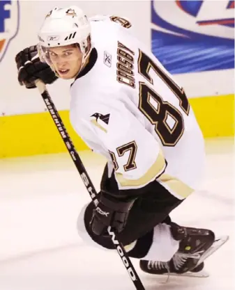  ?? Peter Diana/Post-Gazette ?? Sidney Crosby made his NHL debut Oct. 5, 2005, above, against the New Jersey Devils. He finished with an assist in 15:50, most of it on the second line behind Mario Lemieux.