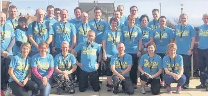  ??  ?? Recovering Troon Tortoises runners enjoy a breather after the Alloa half- marathon