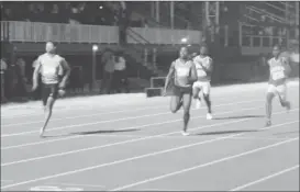  ??  ?? Compton Caesar powers to victory in the boys 100m final.