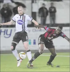  ??  ?? Chris Shields gets the ball away from Ismahil Akinade.