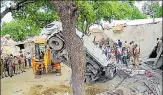  ?? PTI ?? An earthmover removes the mangled remains of a car during the demolition Vikay Dubey’s residence in Kanpur, Saturday.