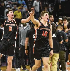  ?? RANDALL BENTON/ASSOCIATED PRESS ?? Princeton guard Ryan Langborg (left) and forward Caden Pierce celebrate a 78-63 victory over Missouri in the second round of the NCAA Tournament on Saturday in Sacramento, Calif. The 15th-seeded Tigers face sixth-seeded Creighton tonight in the Sweet 16.