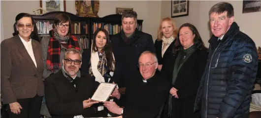  ??  ?? Very Rev. Donal Canon O’Majony, PP Charlevill­e presenting a copy of the baptismal certificat­e of Eliza Lynch to José Arce Farina, Vice- Minister for Higher Education in Paraguay with members of the UCC and Charlevill­e Heritage Society.