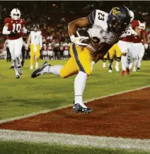  ?? Stephen Lam / The Chronicle ?? California running back Marcel Dancy runs for one of his two touchdowns during the fourth quarter of the annual Big Game against Stanford at Stanford Stadium.