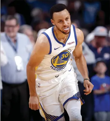  ?? SARAH PHIPPS — THE OKLAHOMAN ?? Stephen Curry reacts after a making a 3-pointer on Saturday. Curry finished with 33points in the blowout victory.