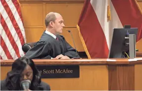  ?? ARVIN TEMKAR/ATLANTA JOURNAL CONSTITUTI­ON ?? Judge Scott McAfee appearing in a hearing on the Trump indictment at the Fulton County Courthouse on Nov. 15, 2023, has scheduled a hearing for closing arguments in the case on Friday.